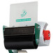 A green and black metal Duck Tape dispenser with a roll of paper in a blade.