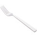 A Libbey stainless steel dinner fork with a white handle.