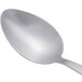 An Arcoroc stainless steel dessert spoon with a silver handle.