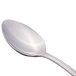 A close-up of a Libbey stainless steel dessert spoon with a silver handle.