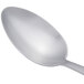 An Arcoroc stainless steel dinner spoon with a silver handle.