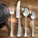 Arcoroc Latham stainless steel dinner forks on a table.