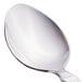 A close-up of a Libbey stainless steel teaspoon with a silver handle.