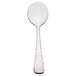 A Libbey stainless steel bouillon spoon with a white handle and silver spoon.