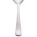 A silver Libbey stainless steel bouillon spoon with a white necktie.