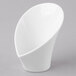 A white Schonwald Calla bowl with a curved shape on a gray background.