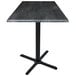 A Holland Bar Stool black steel laminate square table top on a black steel cross base.