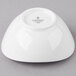 A white Schonwald porcelain dip bowl on a gray background.