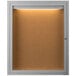 An Aarco satin anodized indoor lighted bulletin board with 1 door.