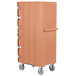 A tan Cambro double compartment tray and sheet pan carrier with wheels.