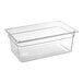 A Carlisle clear polycarbonate food pan on a counter.