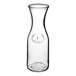 A clear glass wine decanter with a small design on it.
