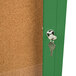 A green Aarco bulletin board cabinet with a key in the lock