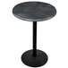 A round black steel table with a black base.