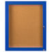 A blue and white rectangular Aarco bulletin board cabinet with a hinged door.