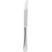 An Arcoroc stainless steel dinner knife with a textured silver handle.