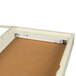 An ivory Aarco bulletin board cabinet with a light inside.