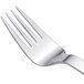 An Arcoroc stainless steel salad fork with a silver handle.