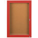 A red Aarco bulletin board cabinet with a hinged glass door.