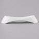 A Schonwald white porcelain bowl with a curved edge.