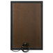 An Aarco black bulletin board cabinet with a black cord inside.