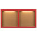 Two red Aarco enclosed bulletin boards with lights.