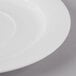 A close-up of a Schonwald Continental white porcelain tapas plate with a white rim.