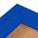 An Aarco blue indoor bulletin board cabinet with cork board inside.