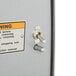 A close up of a silver Hobart PD-35 Power Drive Unit switch.