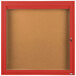 A red Aarco enclosed bulletin board with a glass door.