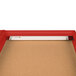 A red Aarco indoor lighted bulletin board cabinet with a light on.