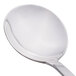 A close-up of a Libbey stainless steel bouillon spoon with a silver handle.