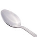 A Libbey stainless steel dessert spoon with a silver handle.