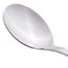 A close-up of a Libbey stainless steel teaspoon with a silver handle.