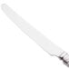 A Libbey stainless steel dinner knife with a white handle.