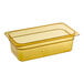 A rectangular amber plastic food pan with a white label.