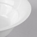 A close-up of a Schonwald Avanti Gusto white porcelain bowl with a white rim.