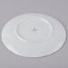 A white Schonwald porcelain saucer with a green design.