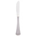 A silver bread and butter knife with a white handle.