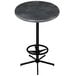A round black steel table with a metal base.