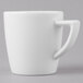 A Schonwald white porcelain espresso cup with a white handle.