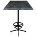 A Holland Bar Stool black steel laminate bar table with a metal base.