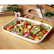 A Villeroy & Boch white porcelain rectangular serving plate with a lid containing a dish of vegetables.