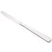 A silver Libbey Vermont dinner knife with a fluted solid handle.