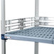 A close-up of a MetroMax Q stackable shelf ledge on a metal shelf.