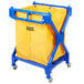 A blue cart with a yellow bag on a blue frame.