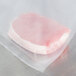 A piece of meat in a VacPak-It gallon size full mesh vacuum packaging bag.