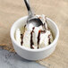 A Master's Gauge stainless steel dessert spoon in a bowl of ice cream.