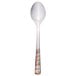 A Master's Gauge stainless steel dessert spoon with a pebblestone design on the handle.