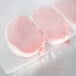 VacPak-It 11 1/2" x 50' roll of full mesh external vacuum packaging bags with pork chops in a bag.